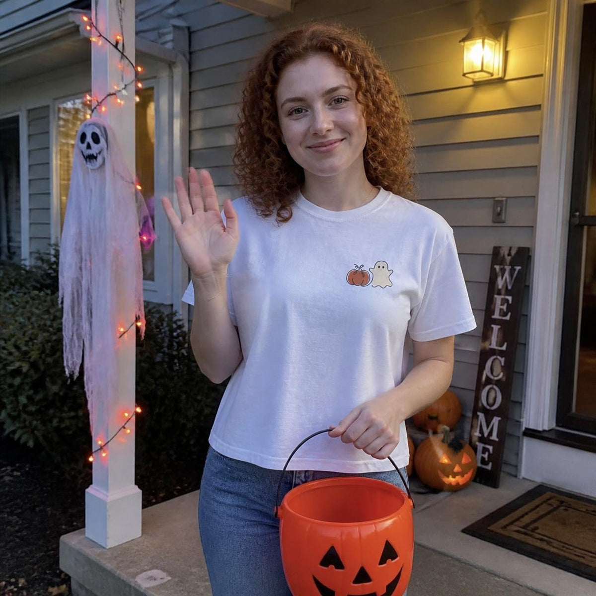 Woman wearing the white Pumpkin Ghost boxy crop tee, lifestyle photo (Color: White)