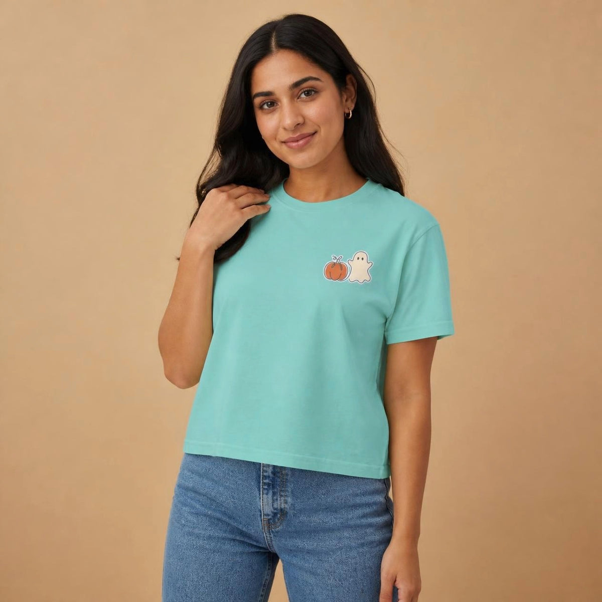 Model wearing the chalky mint Pumpkin Ghost boxy crop tee, studio photo (Color: Chalky Mint)