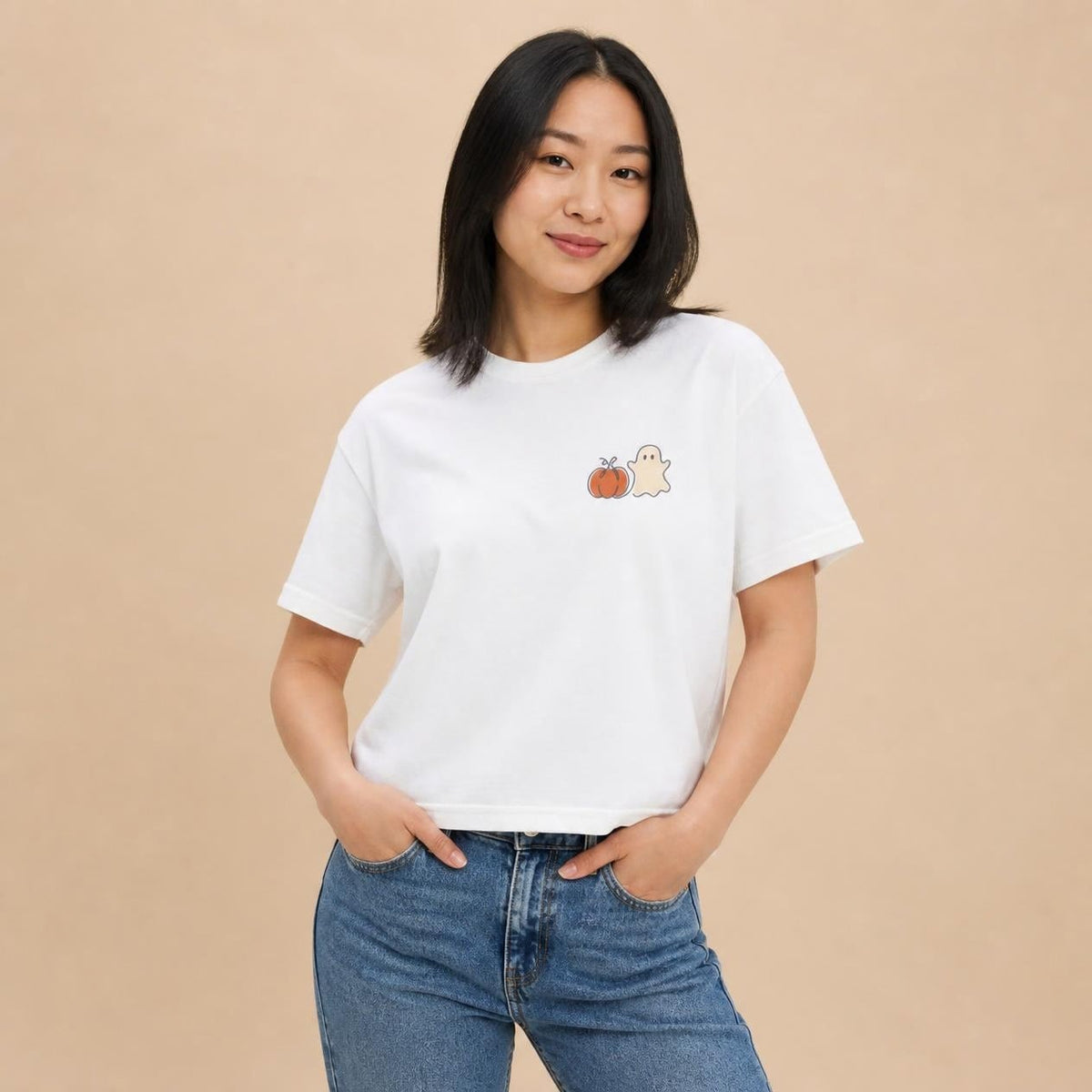Model wearing the white Pumpkin Ghost boxy crop tee, studio photo (Color: White)