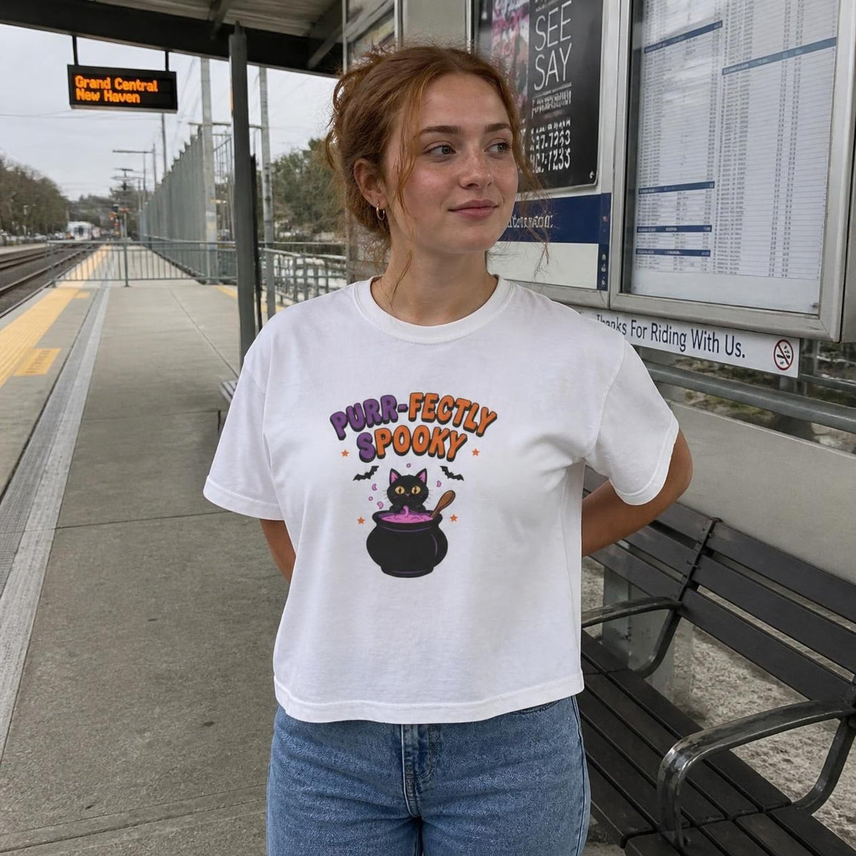 Woman wearing the white Purr-fectly Spooky Black Cat boxy crop tee, lifestyle photo (Color: White)