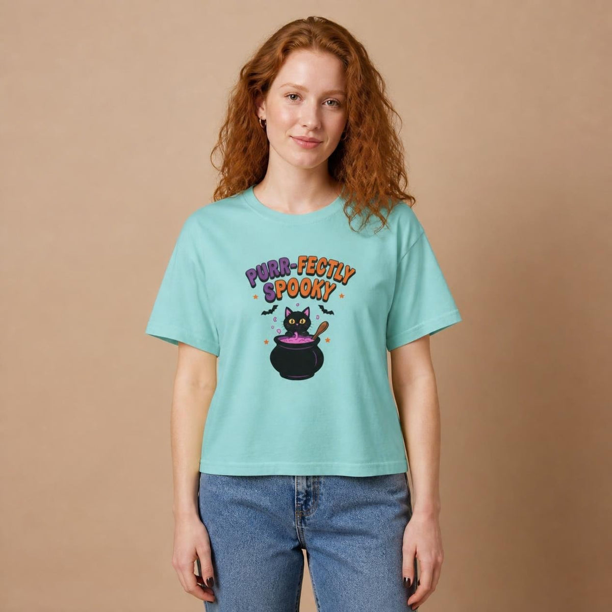 Model wearing the chalky mint Purr-fectly Spooky Black Cat boxy crop tee, studio photo (Color: Chalky Mint)