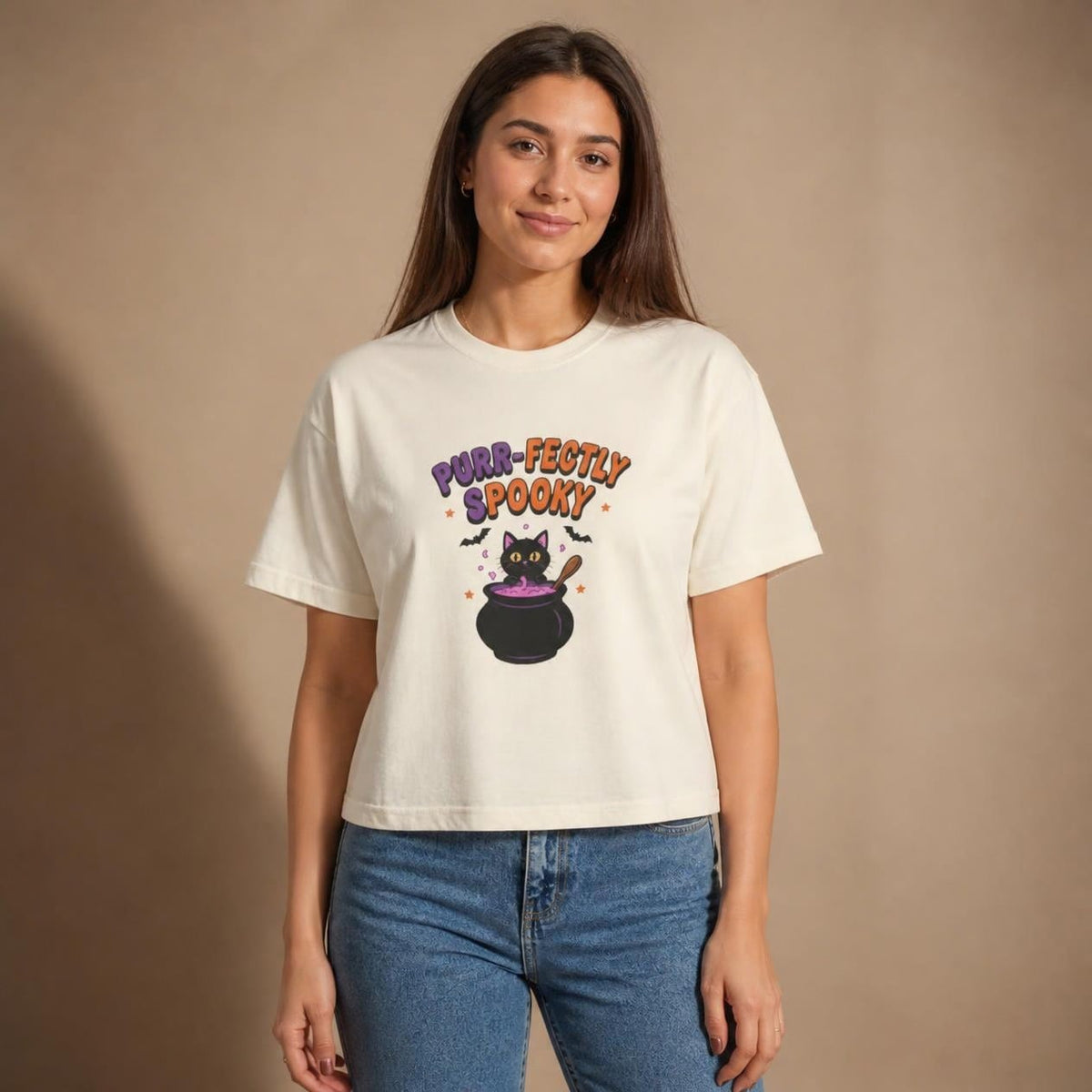 Model wearing the ivory Purr-fectly Spooky Black Cat boxy crop tee, studio photo (Color: Ivory)