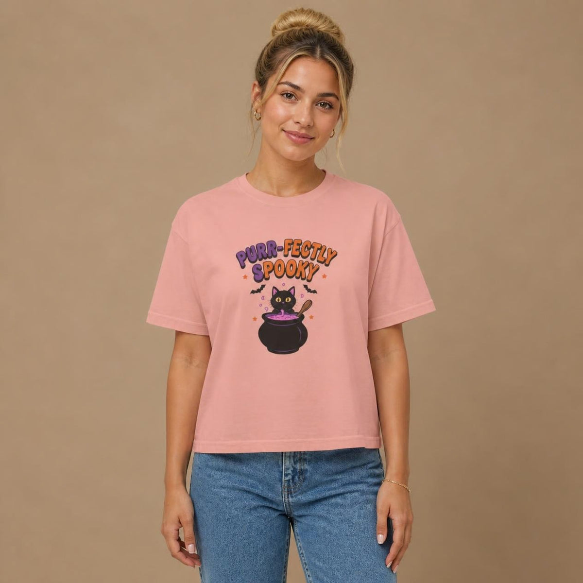 Model wearing the peachy Purr-fectly Spooky Black Cat boxy crop tee, studio photo (Color: Peachy)
