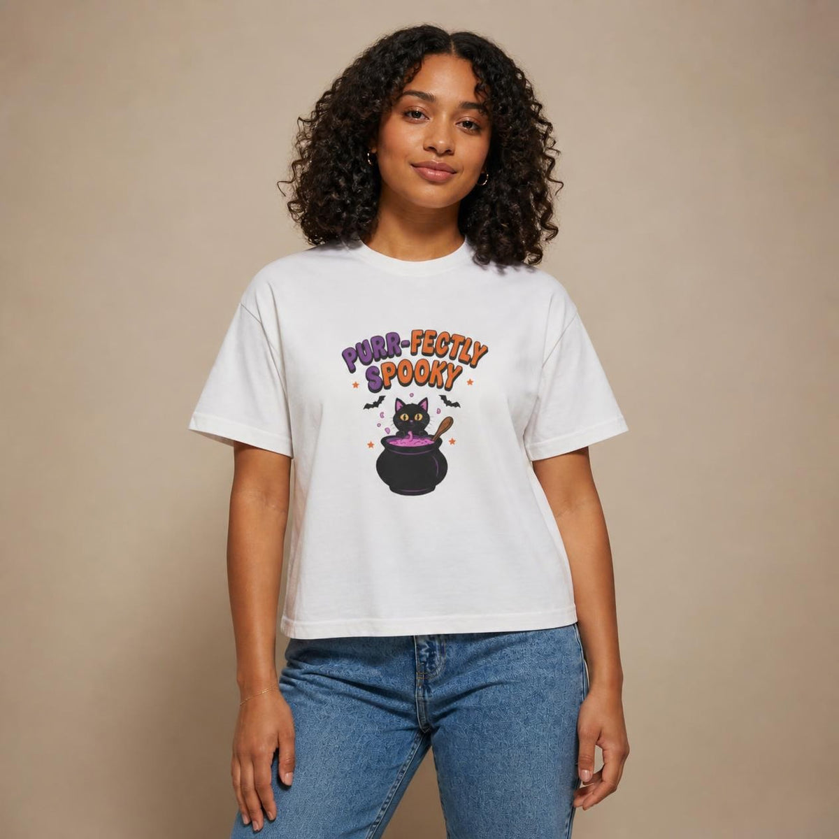 Model wearing the white Purr-fectly Spooky Black Cat boxy crop tee, studio photo (Color: White)