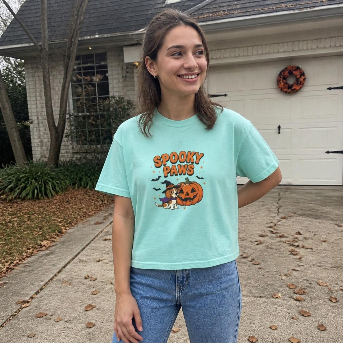 Woman wearing the chalky mint Spooky Paws Dog boxy crop tee, lifestyle photo (Color: Chalky Mint)