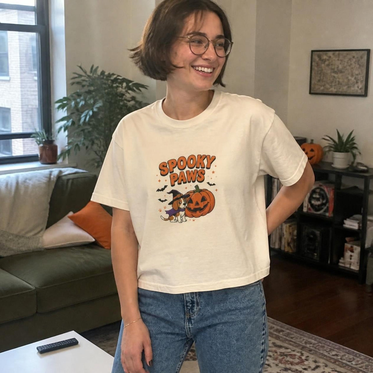 Woman wearing the ivory Spooky Paws Dog boxy crop tee, lifestyle photo (Color: Ivory)