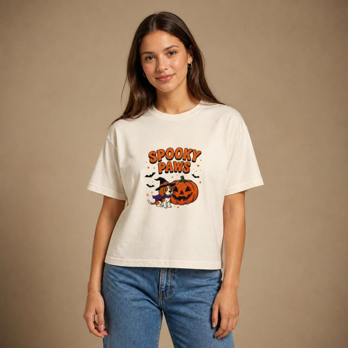 Model wearing the ivory Spooky Paws Dog boxy crop tee, studio photo (Color: Ivory)