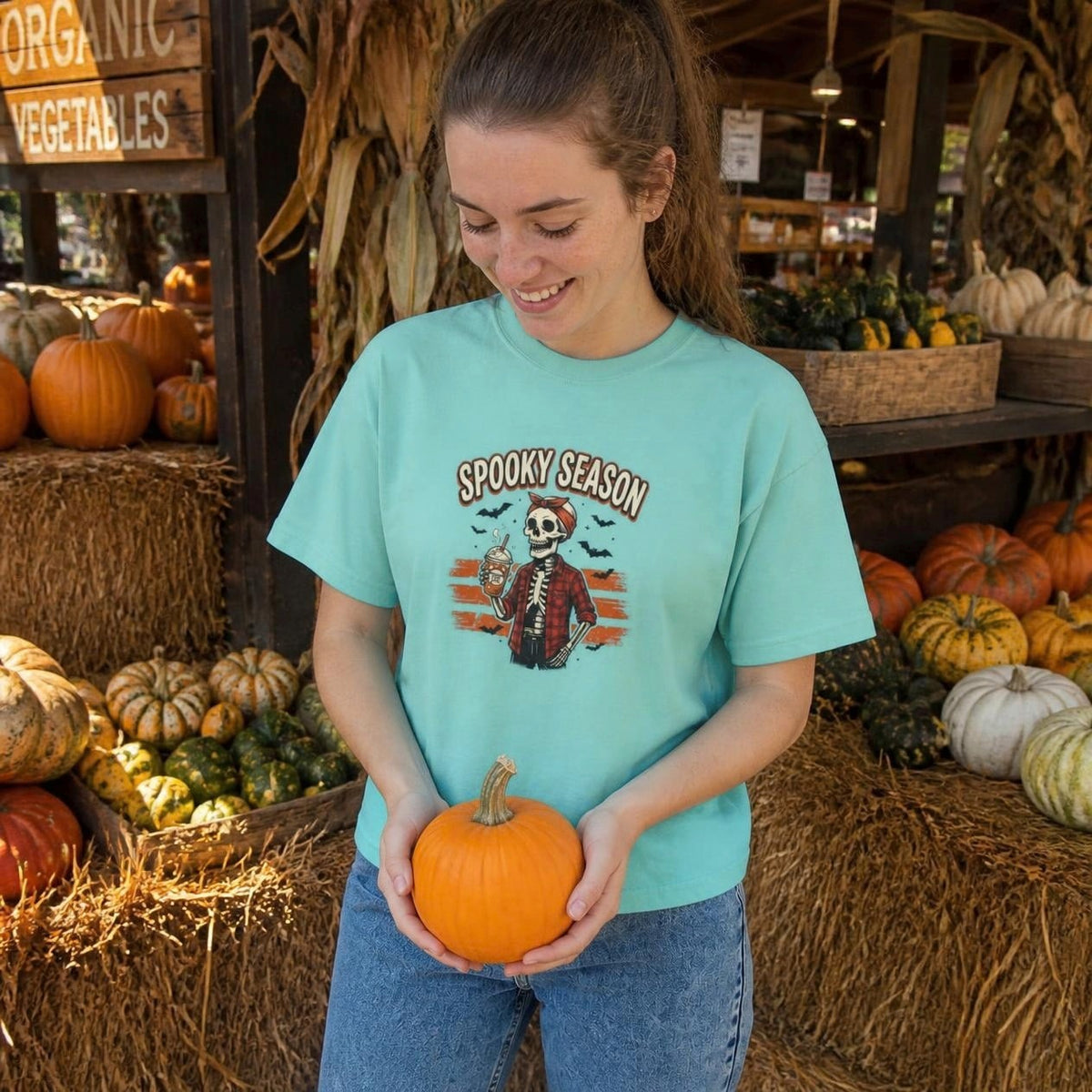Woman wearing the chalky mint Spooky Season Skeleton boxy crop tee, lifestyle photo (Color: Chalky Mint)