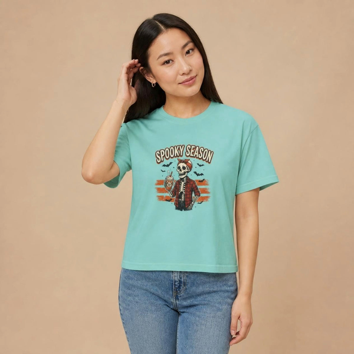 Model wearing the chalky mint Spooky Season Skeleton boxy crop tee, studio photo (Color: Chalky Mint)