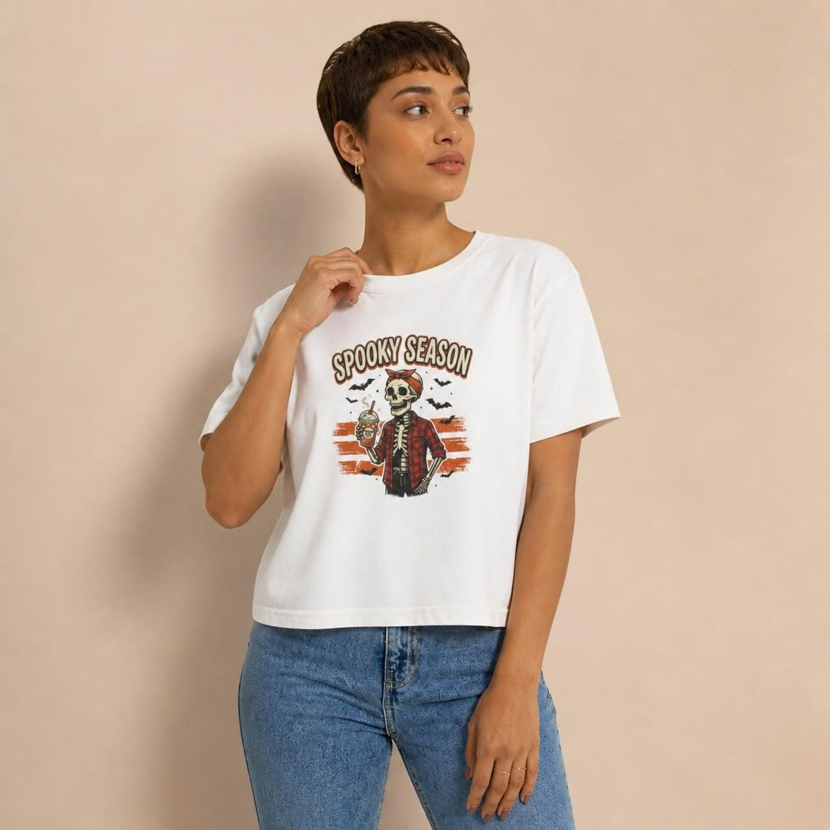 Model wearing the white Spooky Season Skeleton boxy crop tee, studio photo (Color: White)