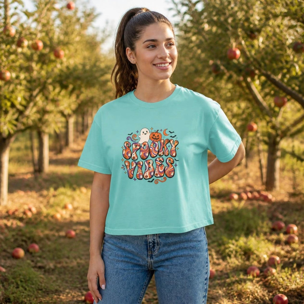 Woman wearing the chalky mint Spooky Vibes Retro boxy crop tee, lifestyle photo (Color: Chalky Mint)