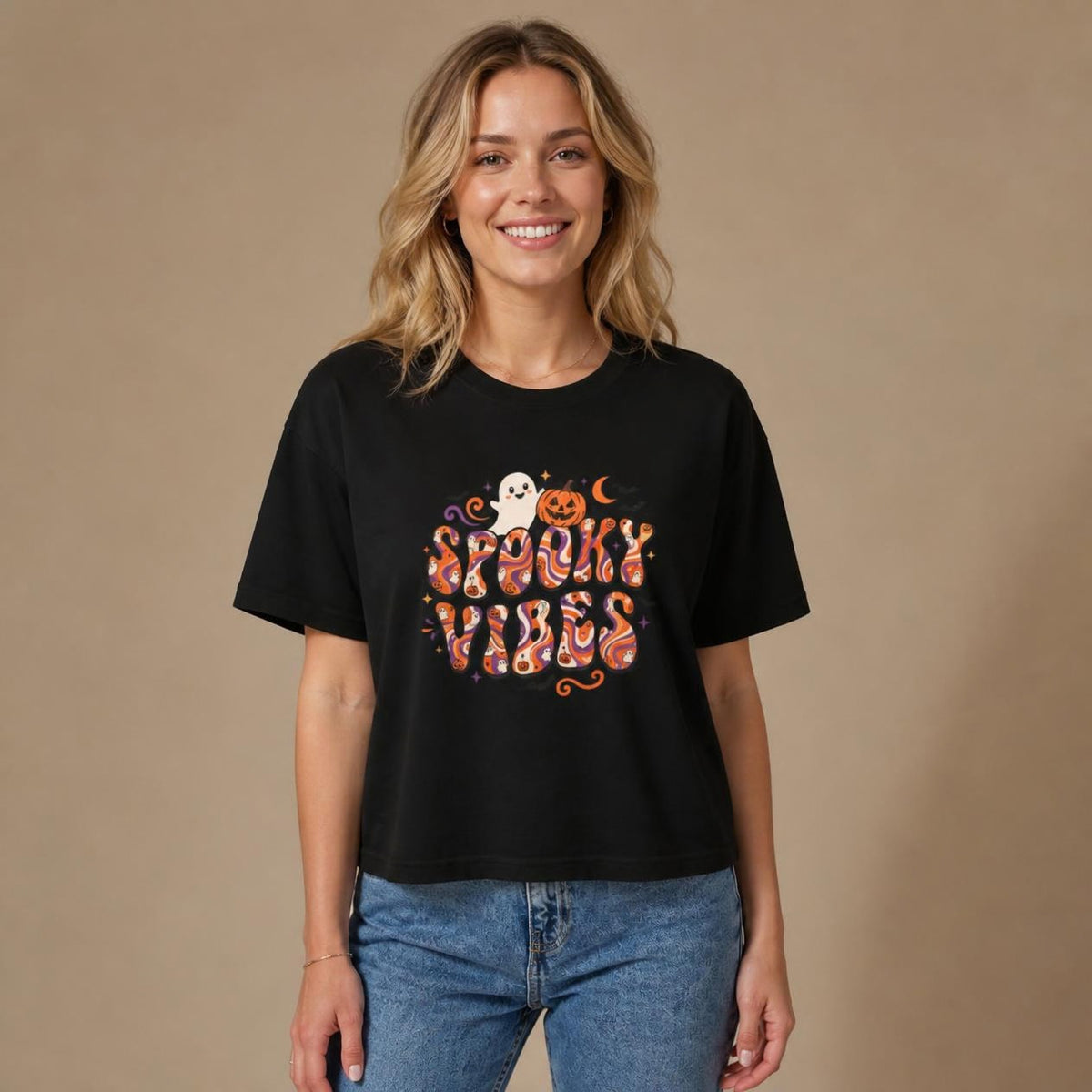 Model wearing the black Spooky Vibes Retro boxy crop tee, studio photo (Color: Black)