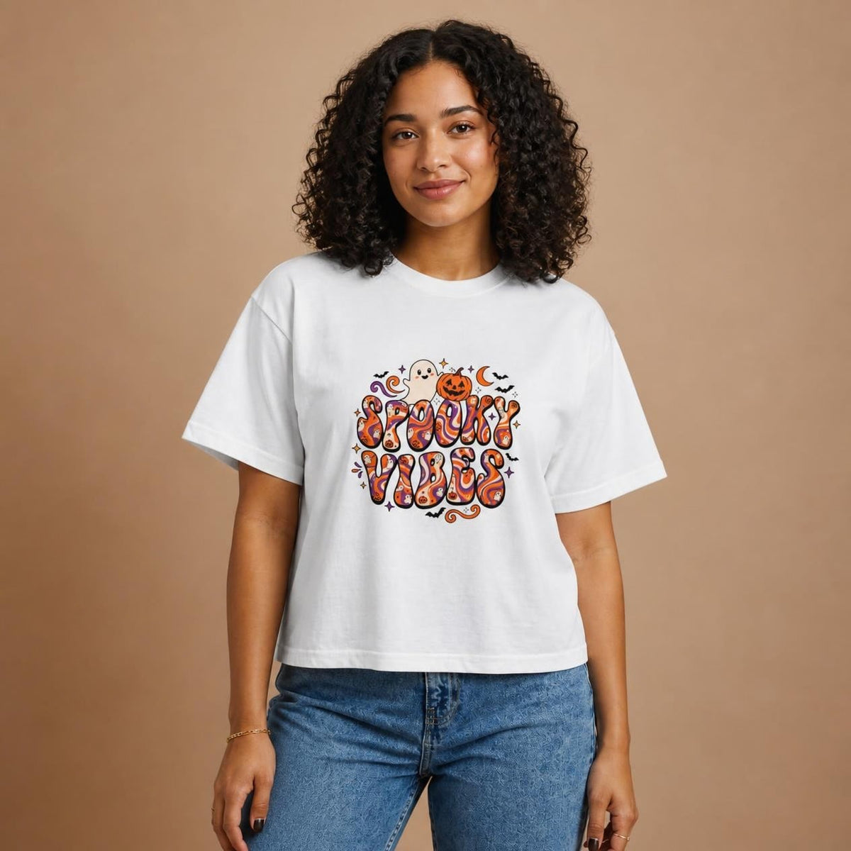 Model wearing the white Spooky Vibes Retro boxy crop tee, studio photo (Color: White)