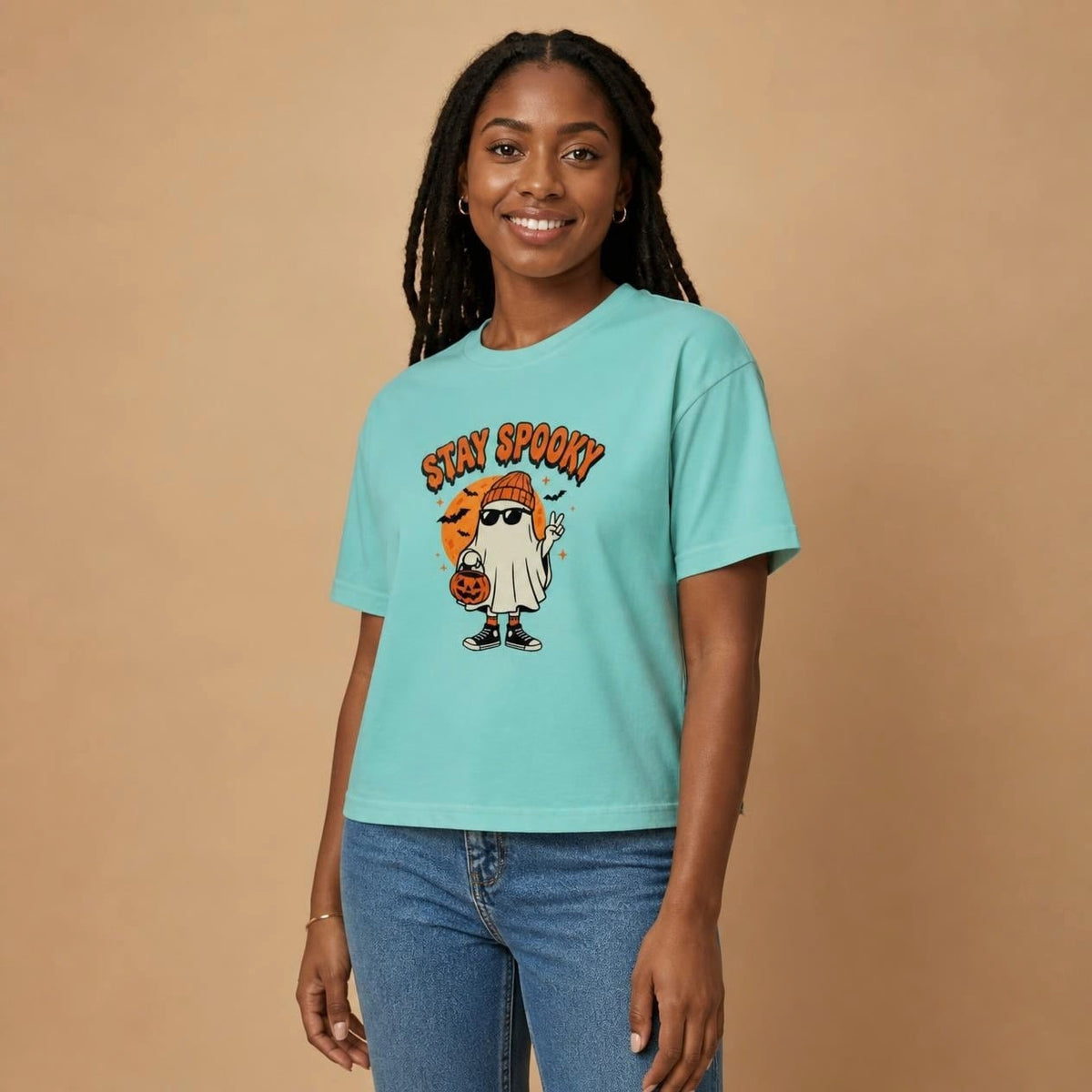 Model wearing the chalky mint Stay Spooky Ghost boxy crop tee, studio photo (Color: Chalky Mint)