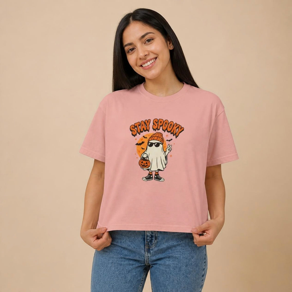 Model wearing the peachy Stay Spooky Ghost boxy crop tee, studio photo (Color: Peachy)