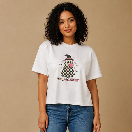 Model wearing the white Trick or Treat Checkered Ghost boxy crop tee, studio photo (Color: White)