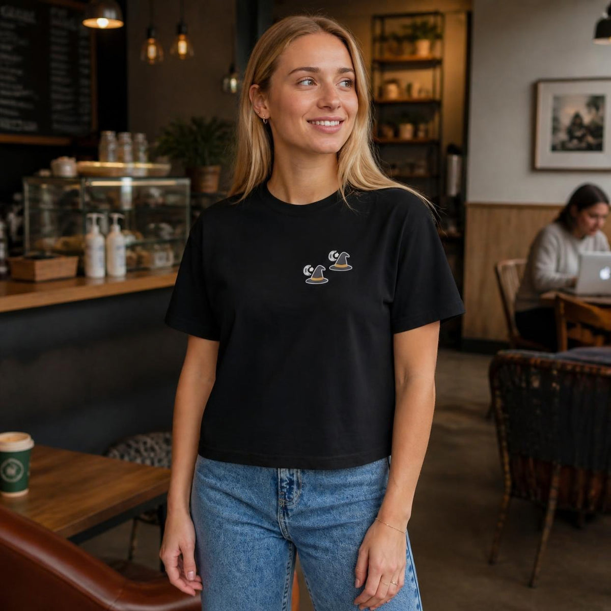 Woman wearing the black Witch Hat boxy crop tee, lifestyle photo (Color: Black)