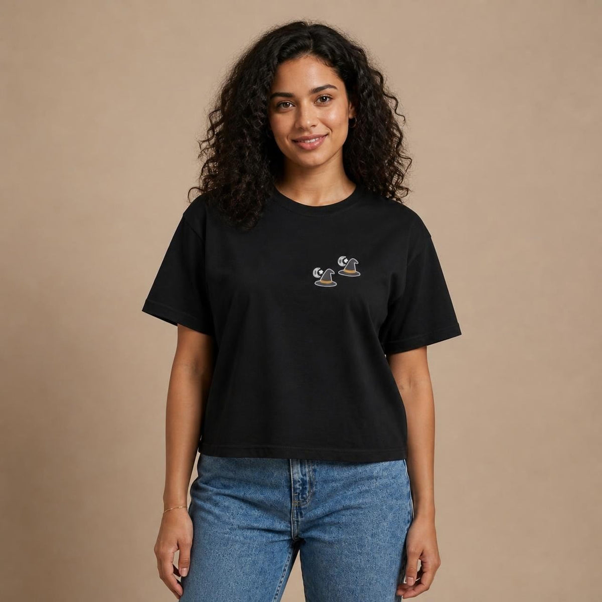 Model wearing the black Witch Hat boxy crop tee, studio photo (Color: Black)