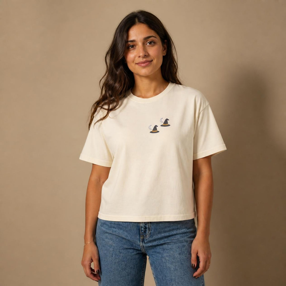 Model wearing the ivory Witch Hat boxy crop tee, studio photo (Color: Ivory)